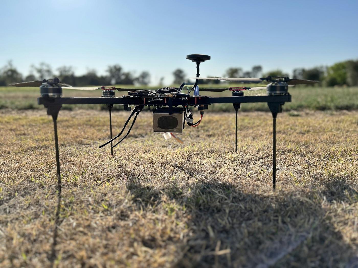 Survey drone standing in a field