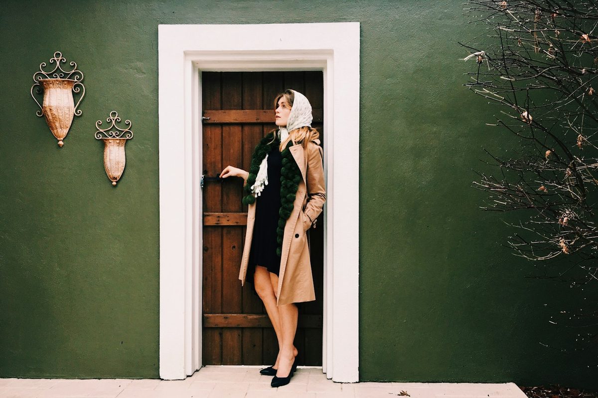 Woman in hijab at a controlled entrance door