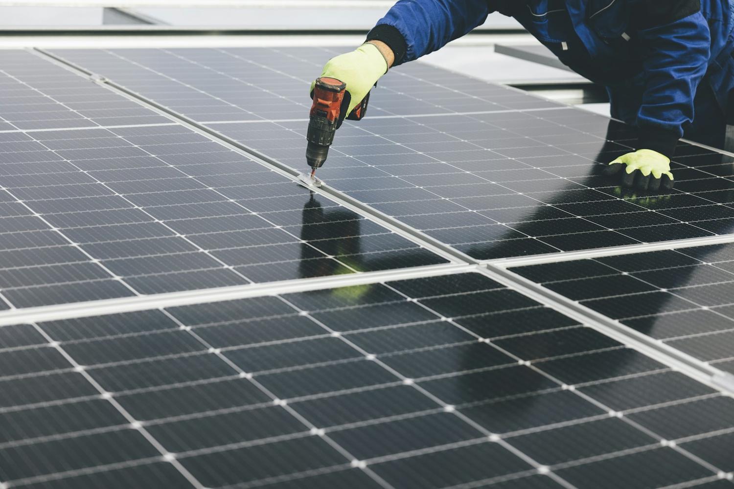 Technician working on a solar panel
